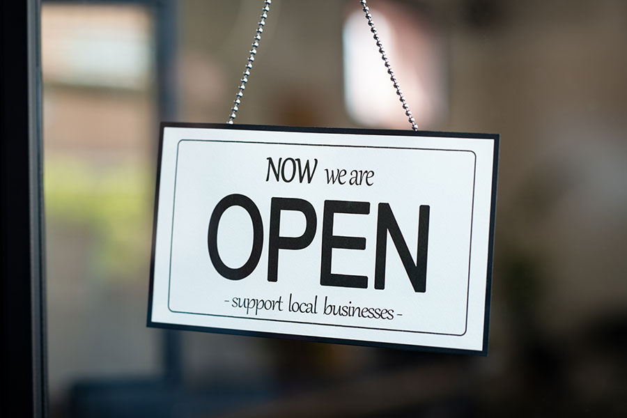 Now we are open sign that supports local small businesses in Bloomington, IL. Get digital marketing services to outshine local competitors.