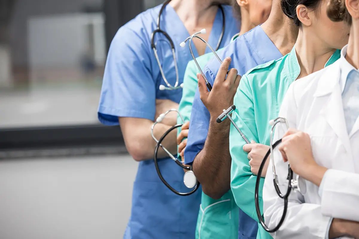 partial view of group of medical workers with equipment in laboratory