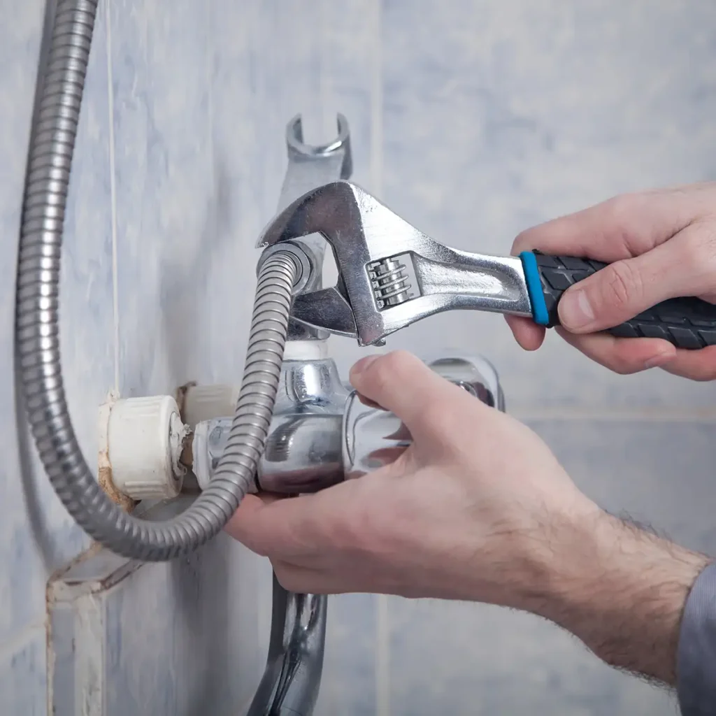 website design for plumbers - plumbing technician repairing a bathroom shower line Collinsville Illinois - metro east - St. Louis Metro - Central Illinois - Springfield IL