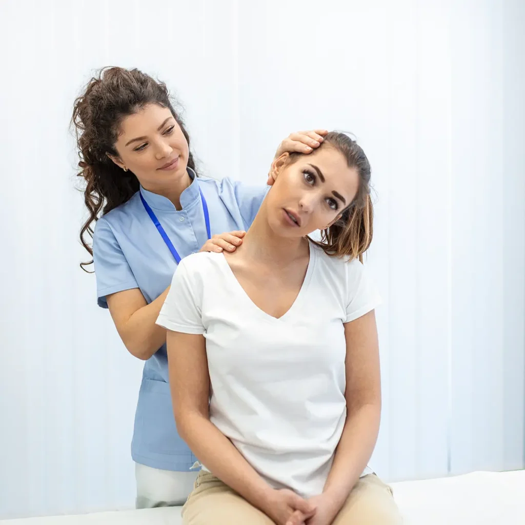 female chiropractic medical professional looking at the alignment of a patient's spine - chiropractor website design solutions - Collinsville Illinois - metro east - St. Louis Metro - Central Illinois - Springfield IL