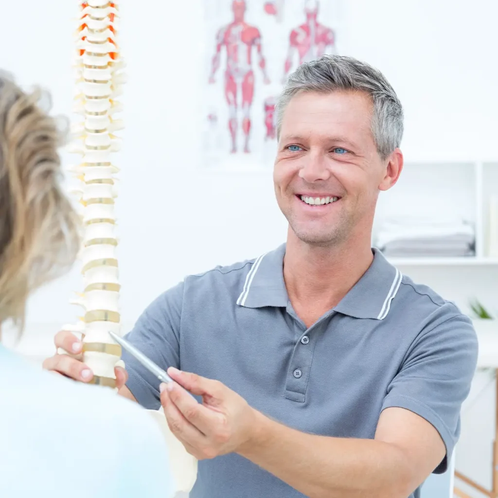 chiropractor explaining the spine to a patient - chiropractic web design company - Collinsville Illinois - metro east - St. Louis Metro - Central Illinois - Springfield IL