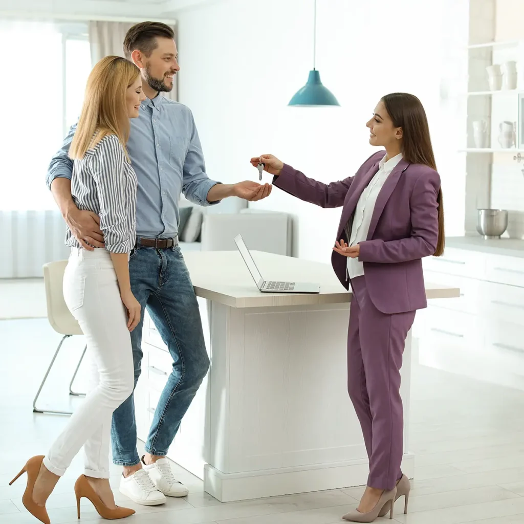 real estate agent handing keys of home to new owners - real estate broker website design service - Collinsville Illinois - metro east - St. Louis Metro - Central Illinois - Springfield IL