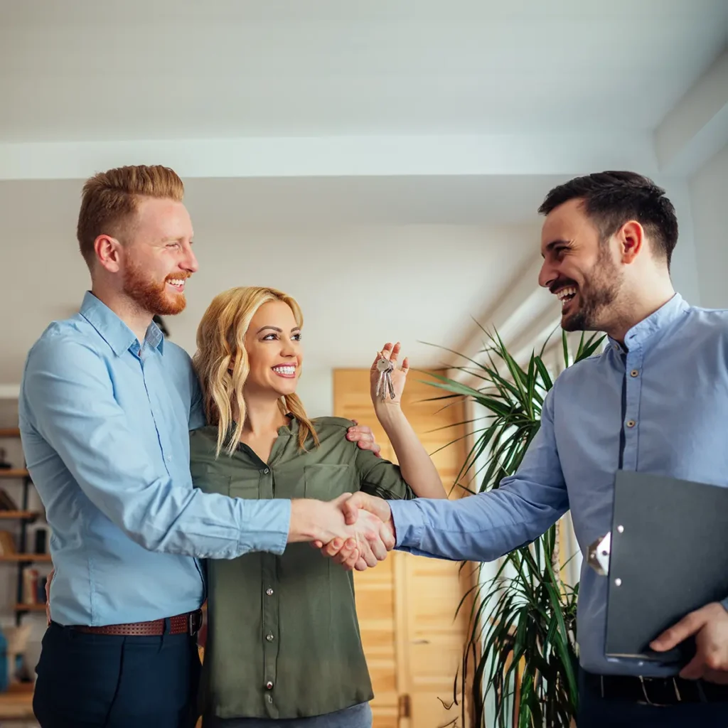 new home owners shaking hand with real estate agent - real estate website design solutions - Collinsville Illinois - metro east - St. Louis Metro - Central Illinois - Springfield IL