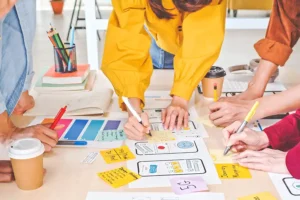 Right Click Digital, Inc.—A team of people in a website design agency planning the design of a new website for a client in St. Louis, MO.