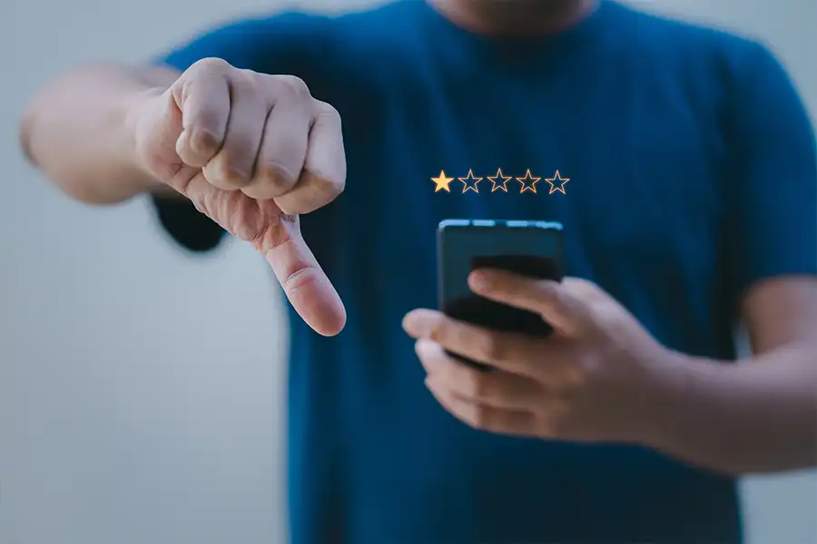 Right Click Digital—An unhappy customer uses his phone to rate a company with a one-star review in St. Louis, MO.