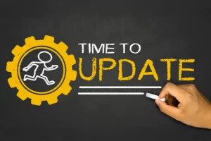 Right Click Digital—a chalkboard with a little stick figure running inside a yellow gear next to a message that says, “Time to Update,” showcasing that ignoring website updates is not a good idea.