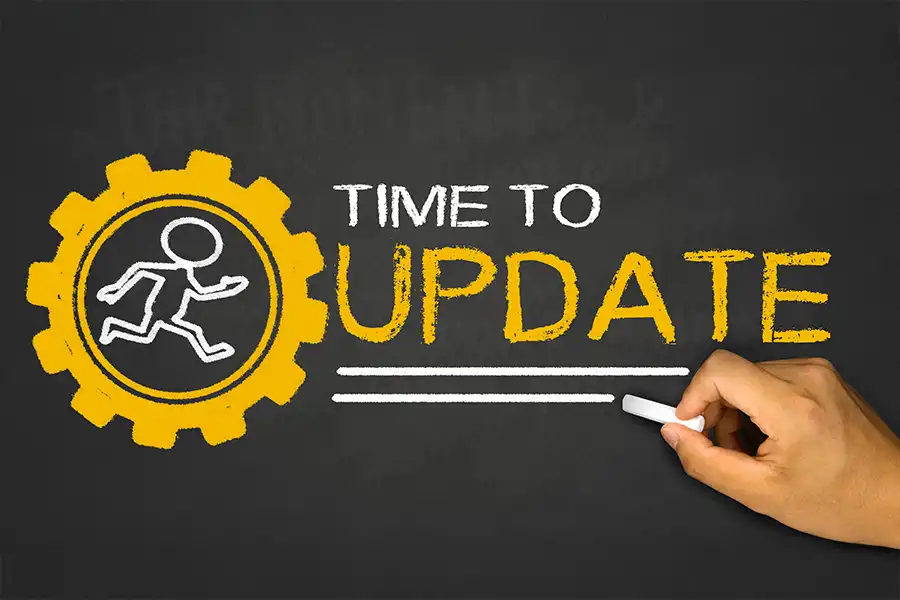 Right Click Digital—a chalkboard with a little stick figure running inside a yellow gear next to a message that says, “Time to Update,” showcasing that ignoring website updates is not a good idea.
