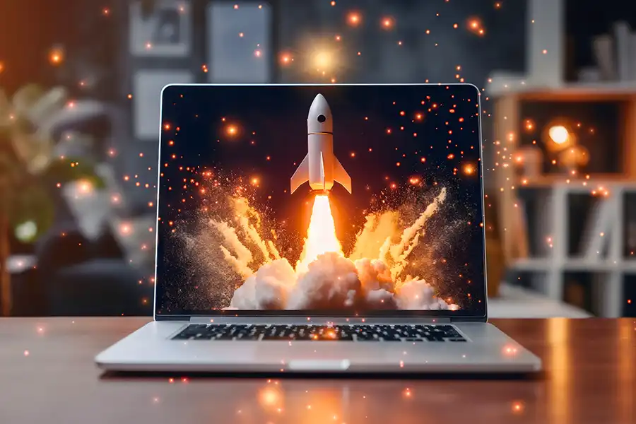 Right Click Digital, Inc. – a laptop showcasing a brand new website launch in Edwardsville, IL, with an onscreen rocket launch display.