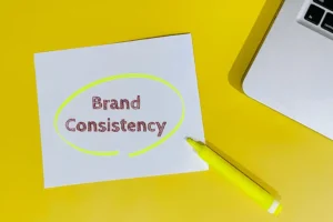 Right Click Digital, Inc. – A piece of paper with “Brand Consistency” stamped on it in red. The text has been circled with a bright yellow highlighter.
