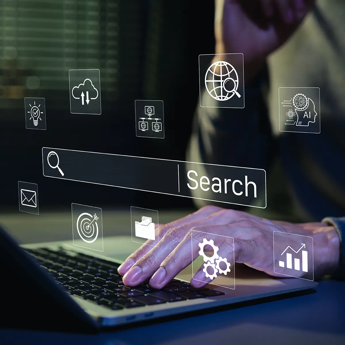 Person typing on laptop with digital search bar and marketing icons to represent AI search - collinsville il