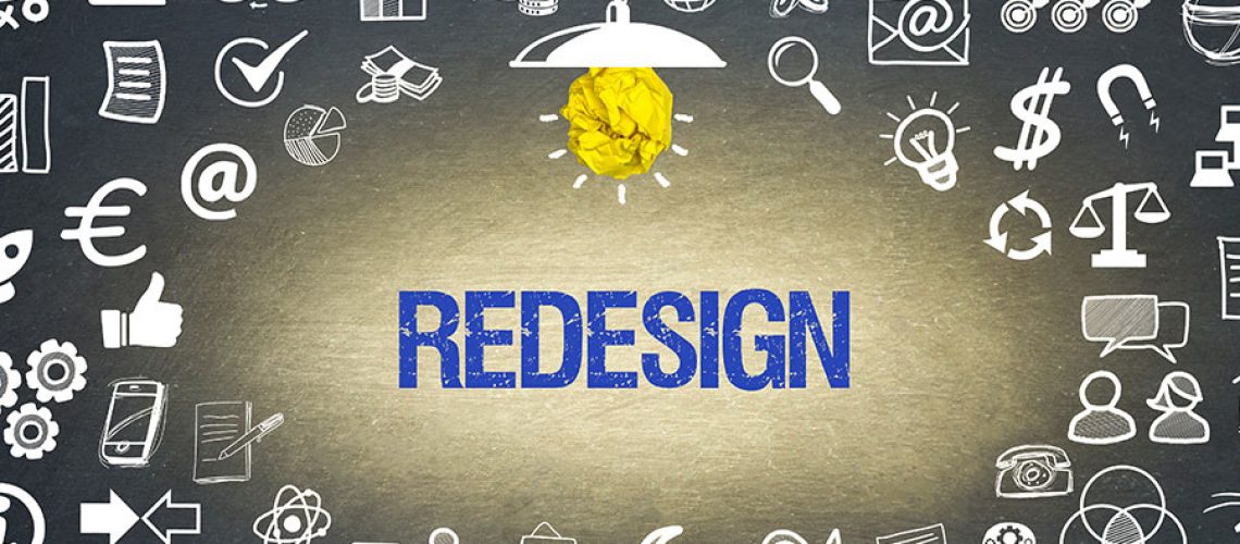 Black and white image with blue text that says redesign to represent website redesign services in Decatur, IL.